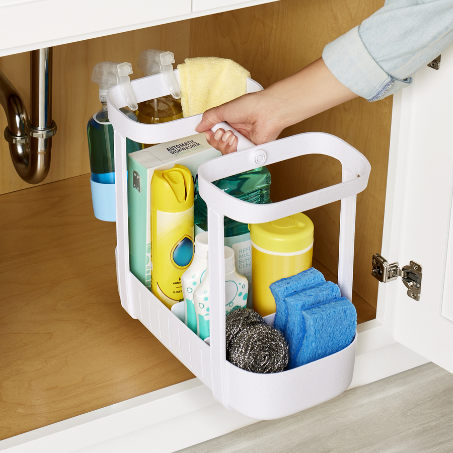 Organized cleaning caddy with various supplies in compartments